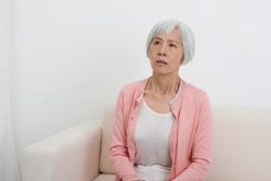 A senior with worrying face
